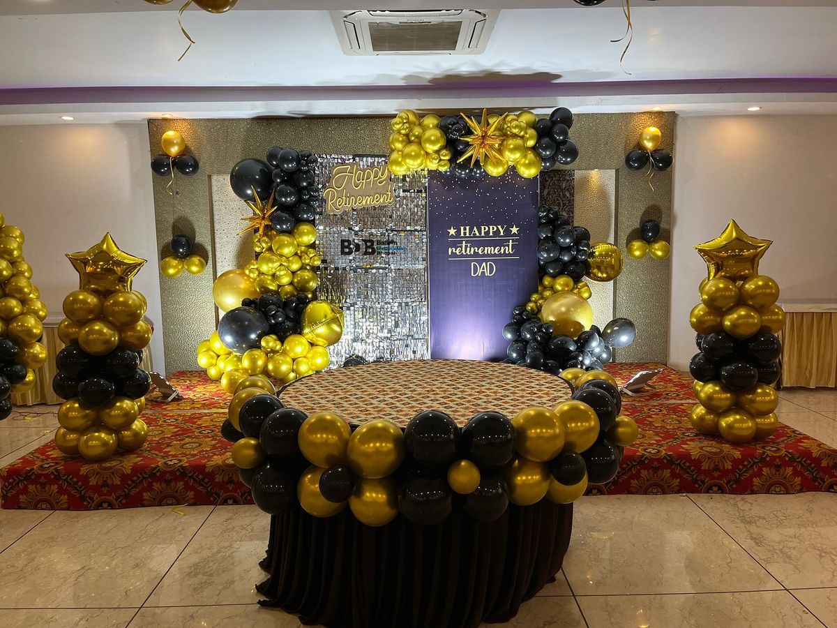 Black and gold retirement party decoration in Hyderabad banquet hall by Hyderabadi Events