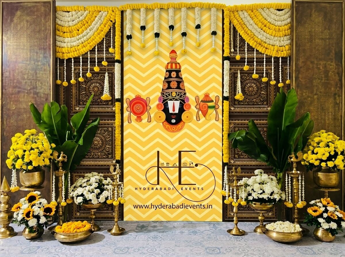 Tirupati Balaji theme backdrop decoration with marigold garlands, banana leaves and brass decor setup.
