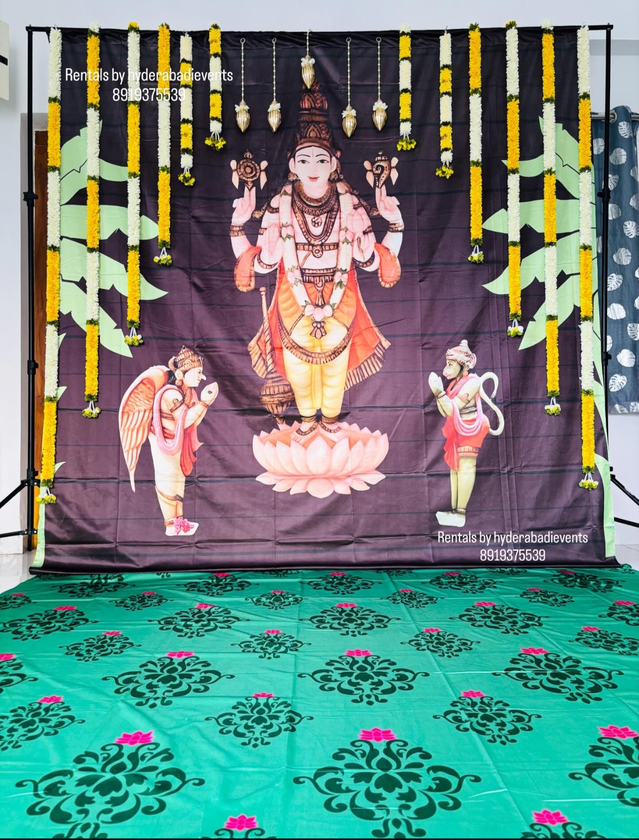 Lord Venkateswara traditional backdrop rental with floral garlands and temple theme decor for pooja and spiritual events in Hyderabad.