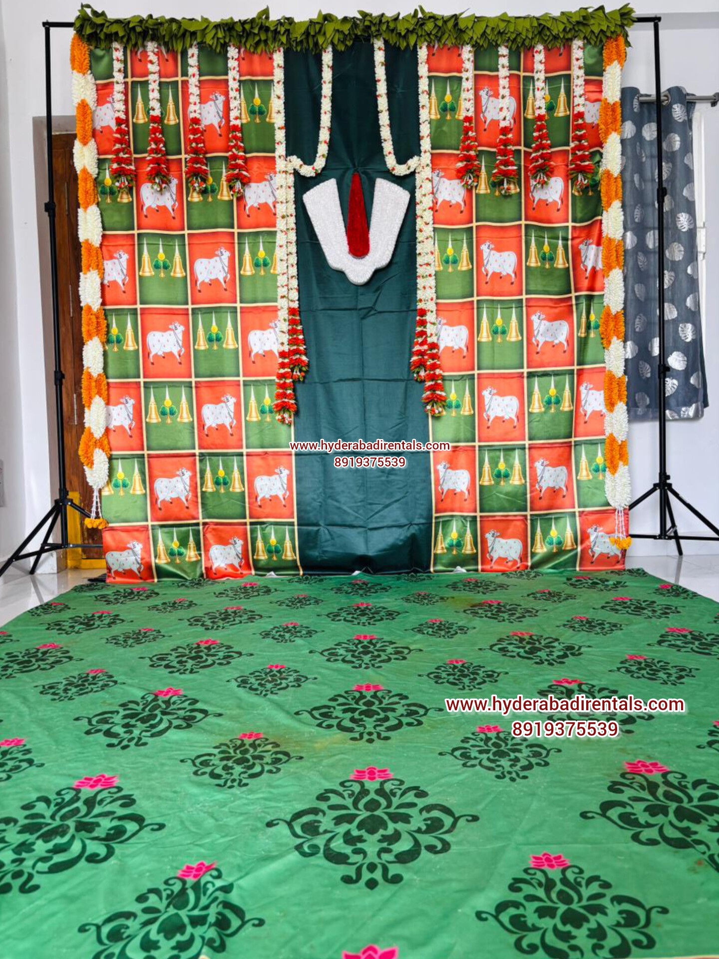 Vaishnav namam traditional backdrop rental with floral garlands and South Indian festive decor for pooja and spiritual ceremonies in Hyderabad.
