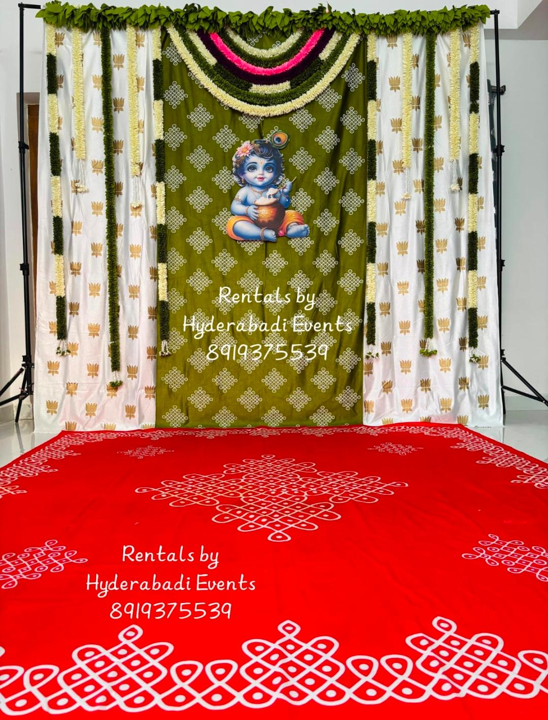 Traditional Krishna themed floral backdrop rental with jasmine garlands and South Indian decor styling for pooja and cradle ceremonies in Hyderabad.