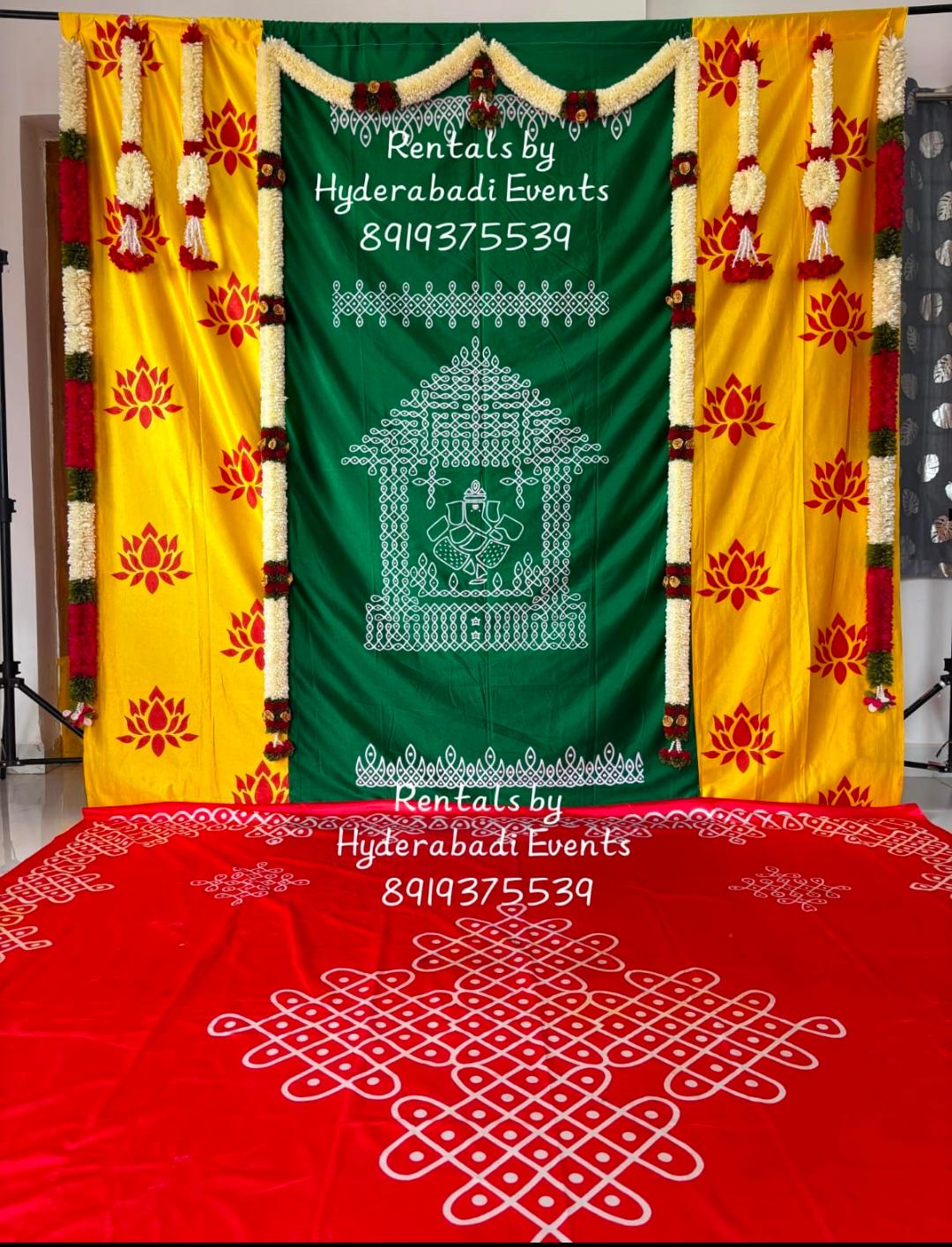 Traditional Ganesha pooja backdrop rental with yellow lotus drapes and floral garlands for festive events in Hyderabad.