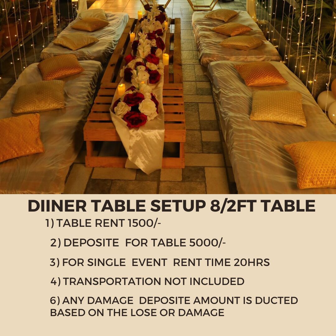 Luxury floor dining table setup with cushions and decorative floral centerpiece for weddings and private events in Hyderabad