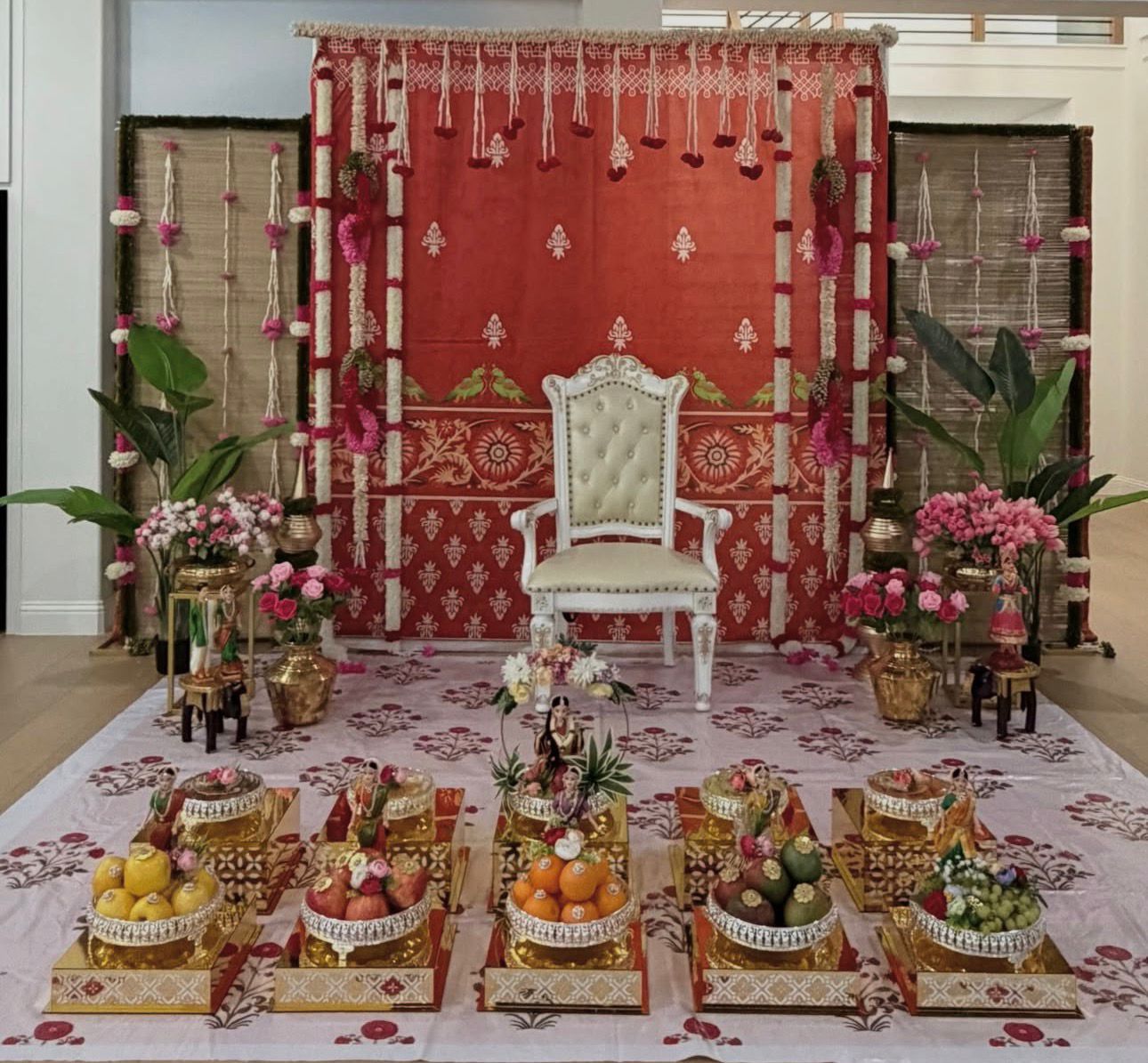 Premium South Indian traditional ceremony decoration with floral garlands and cultural backdrop